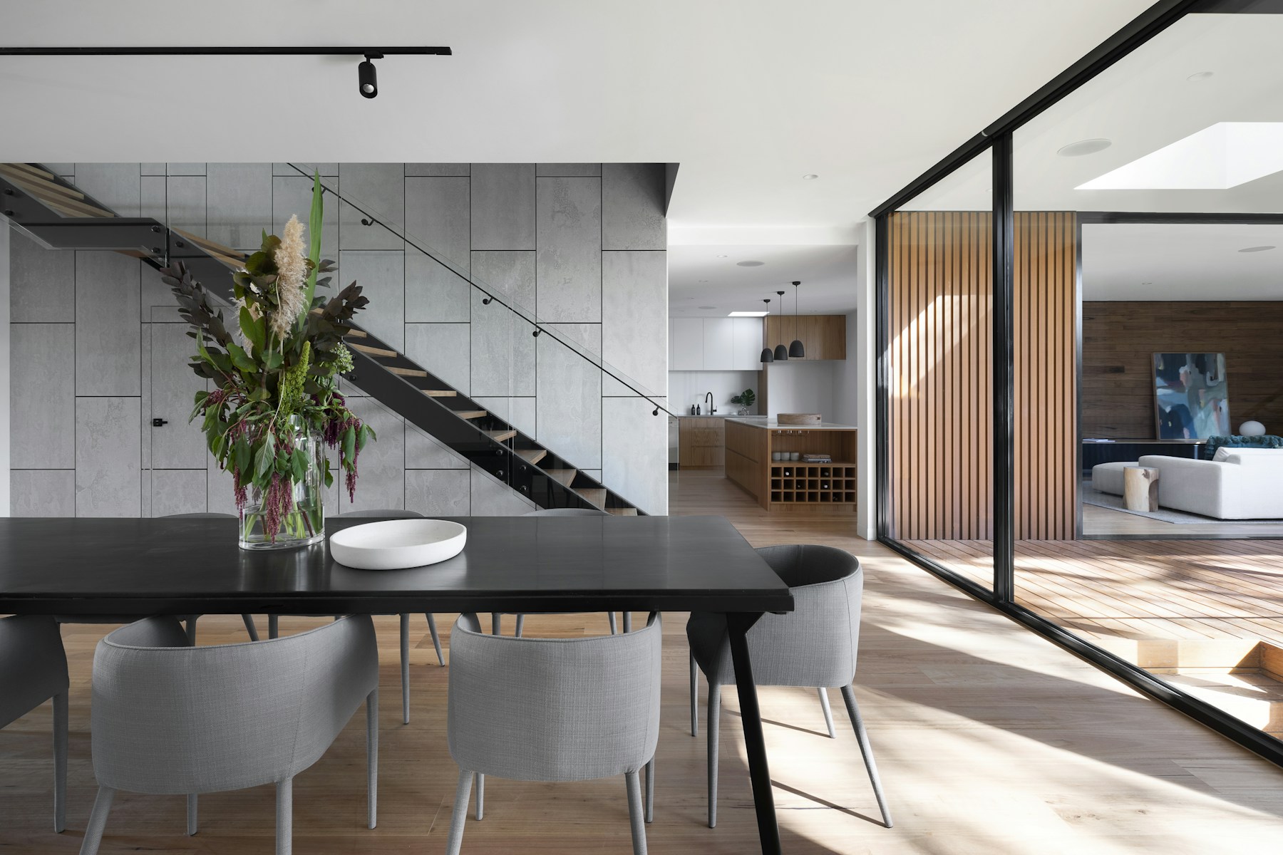 Custom dining area with oak, stone, and blackened steel details